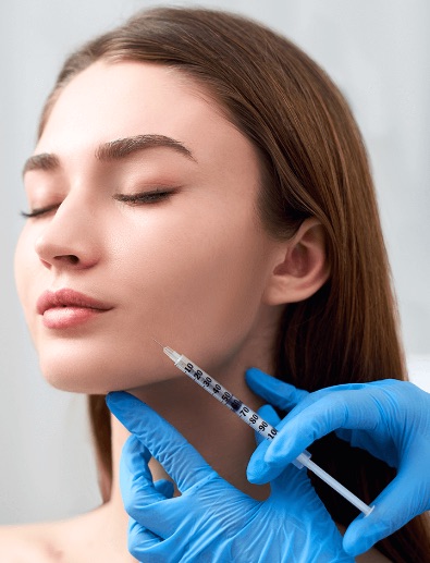 A woman getting injections in her face